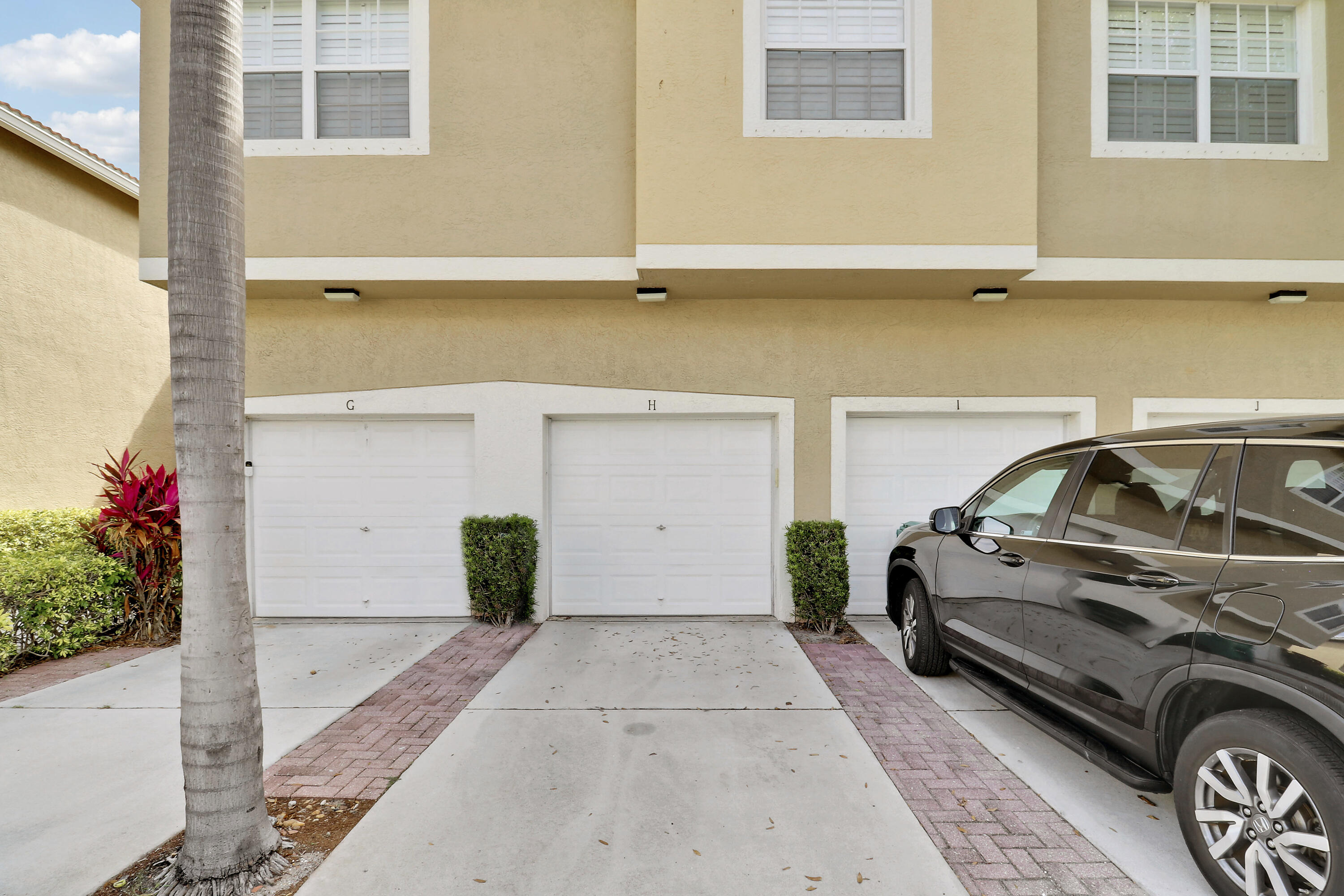 104 Lighthouse Circle, Unit H2 Tequesta, FL 33469 - Photo 32 of 45 a view of a car garage