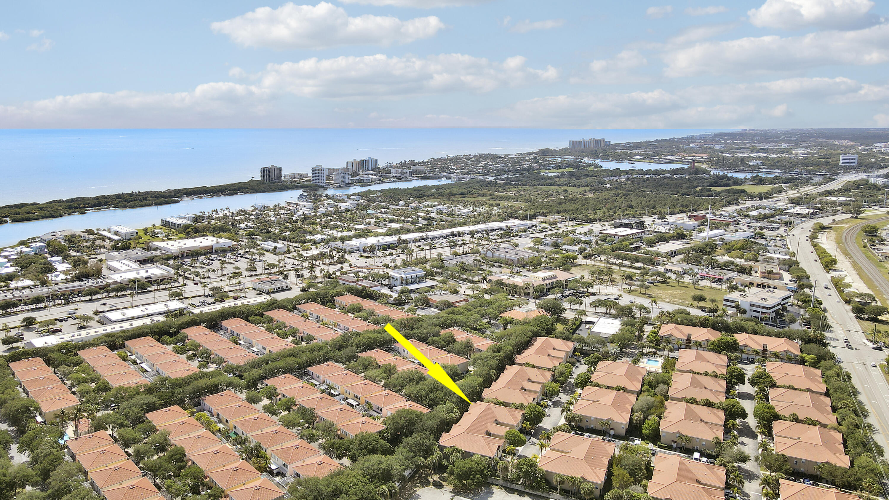 104 Lighthouse Circle, Unit H2 Tequesta, FL 33469 - Photo 39 of 45 an aerial view of residential building with parking space
