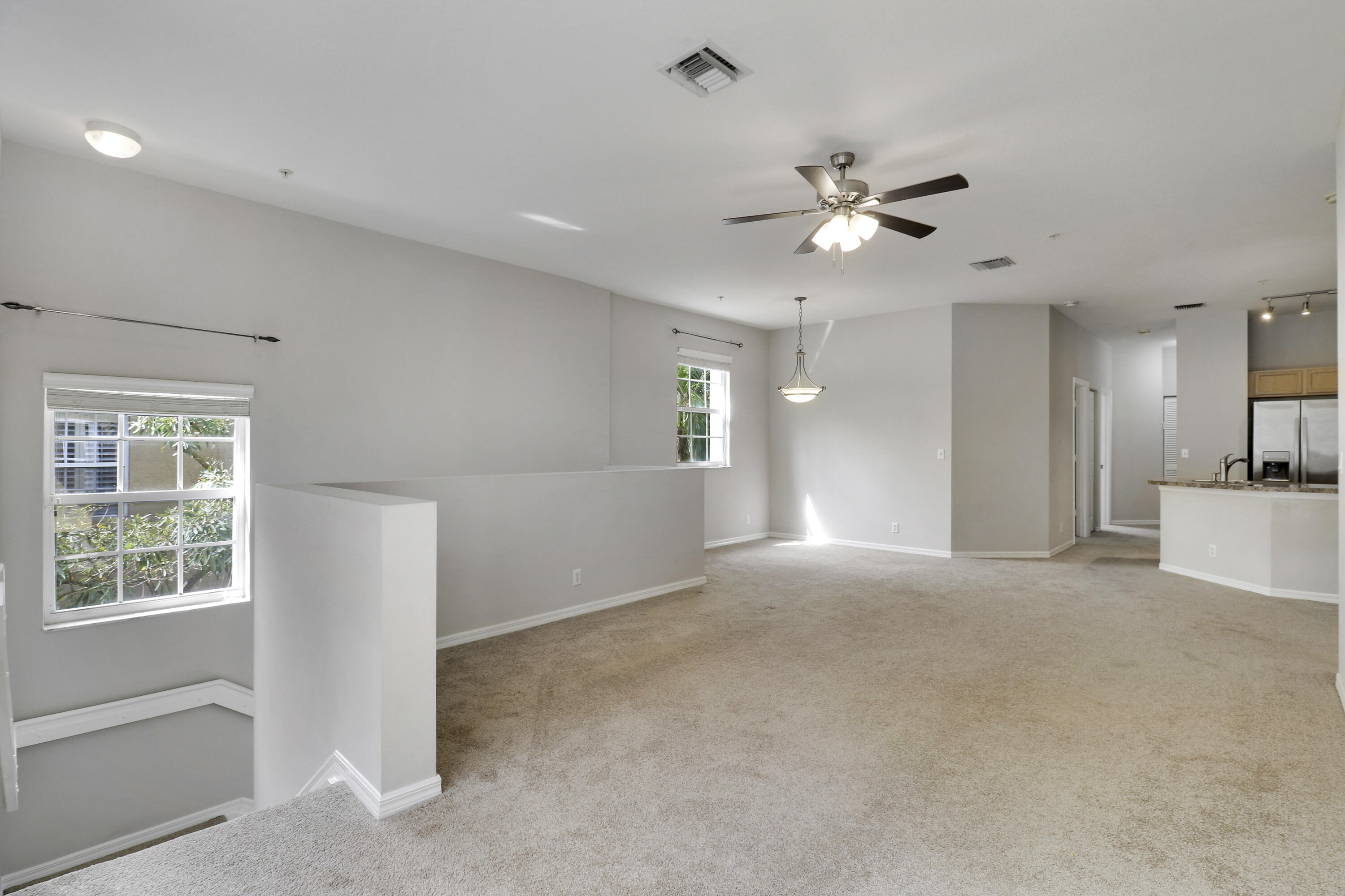 104 Lighthouse Circle, Unit H2 Tequesta, FL 33469 - Photo 4 of 45 a view of an empty room with a window