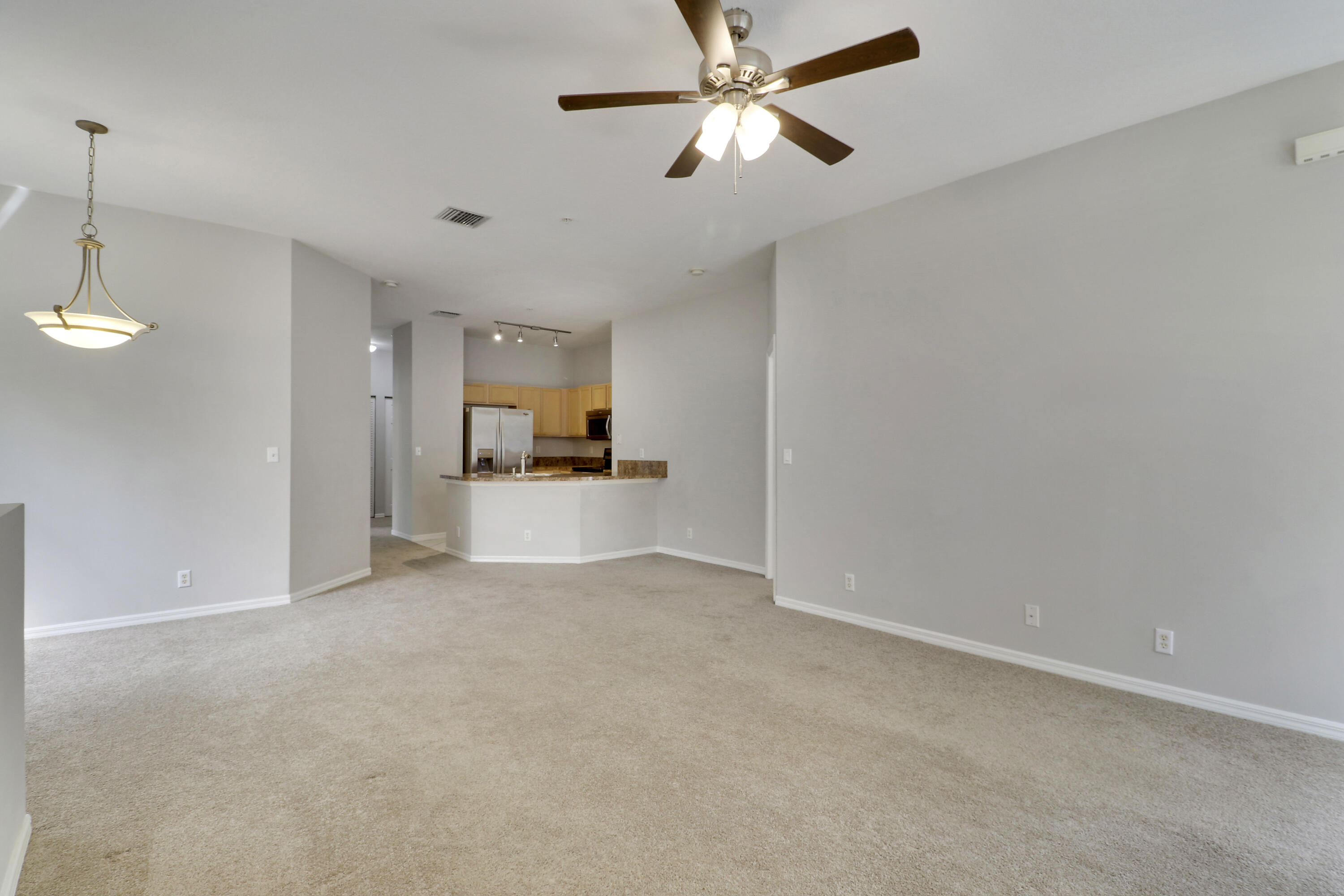 104 Lighthouse Circle, Unit H2 Tequesta, FL 33469 - Photo 5 of 45 a view of empty room with a kitchen