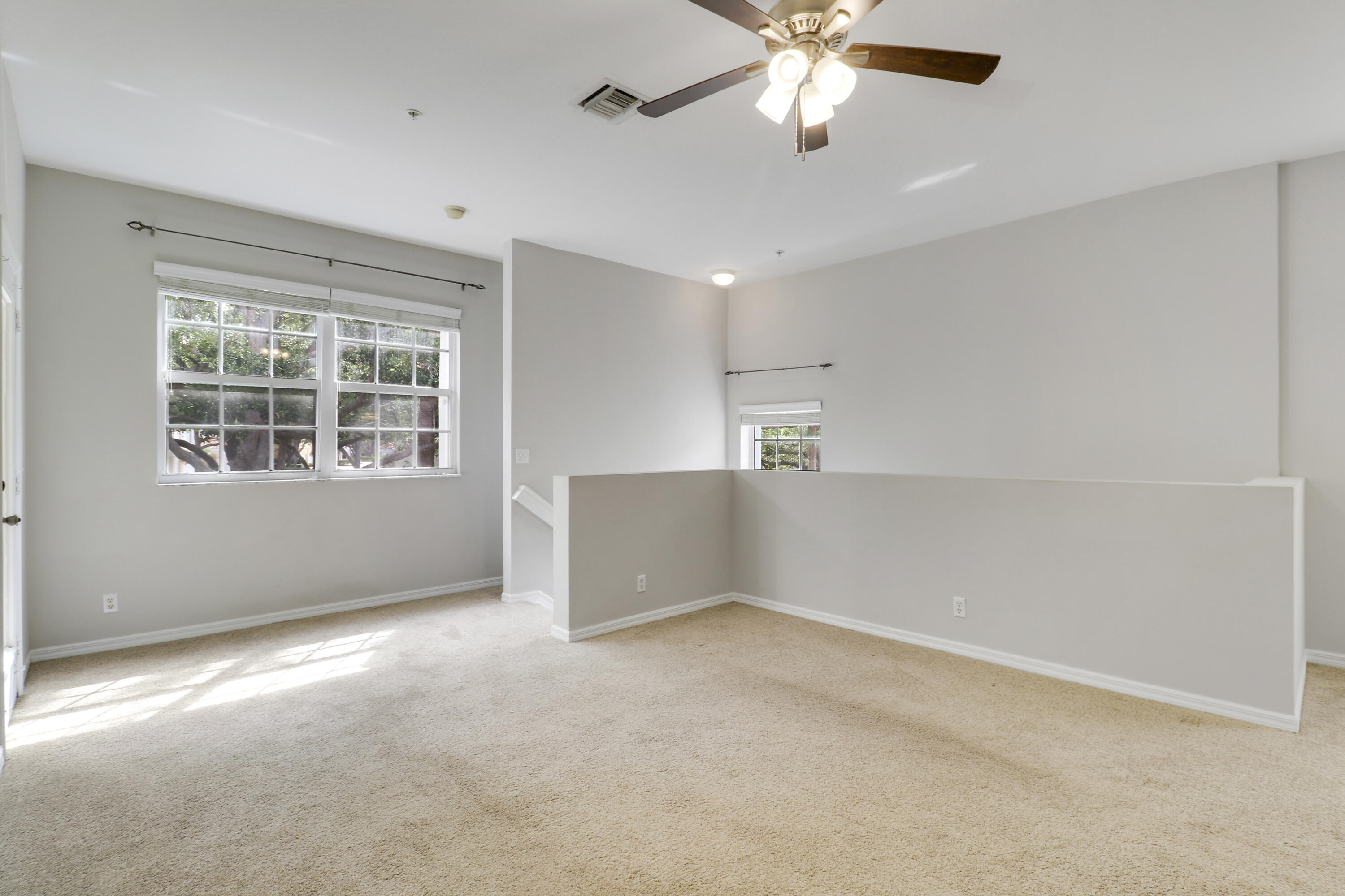 104 Lighthouse Circle, Unit H2 Tequesta, FL 33469 - Photo 7 of 45 an empty room with windows and fan