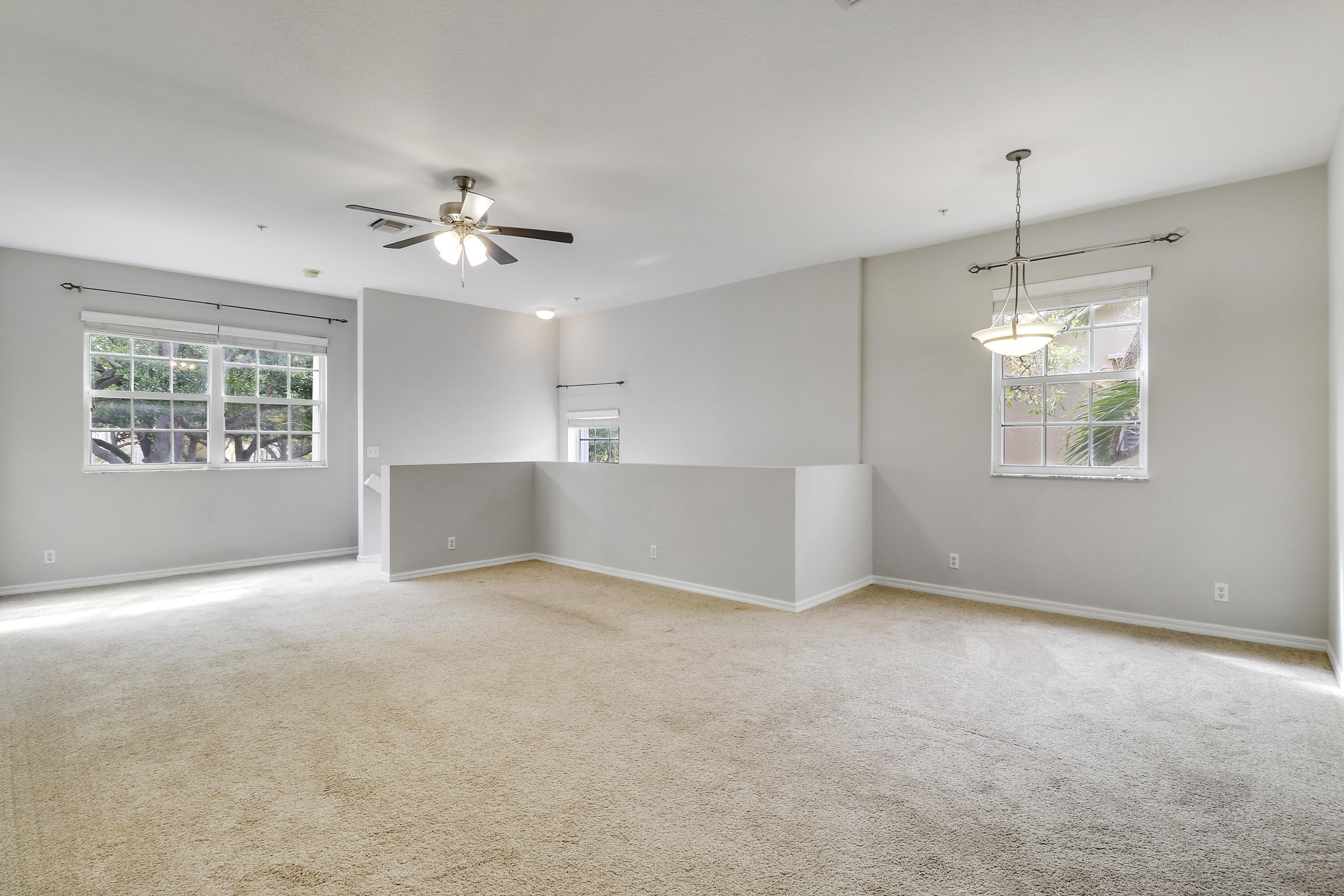 104 Lighthouse Circle, Unit H2 Tequesta, FL 33469 - Photo 8 of 45 a view of an empty room with a window