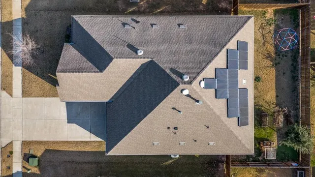 an aerial view of a house with a garage