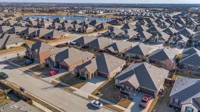 an aerial view of a yard with table and chairs