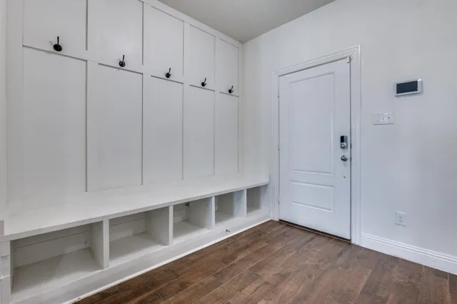 a view of an empty room with white walls