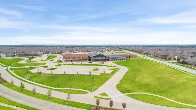 swimming pool view with a garden space
