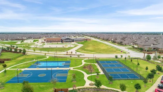 an aerial view of a tennis ground