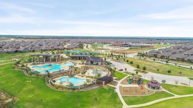 a view of a swimming pool with a table and chairs