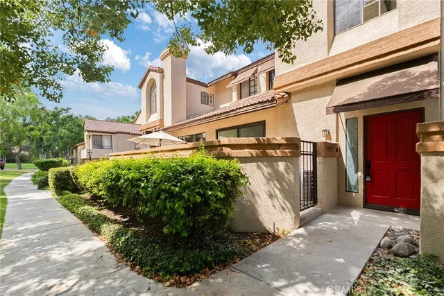 a view of a building with a yard
