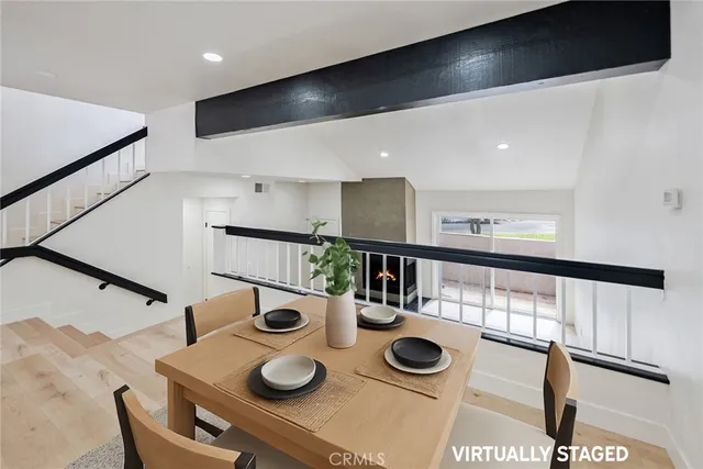 a kitchen with dining table and chairs