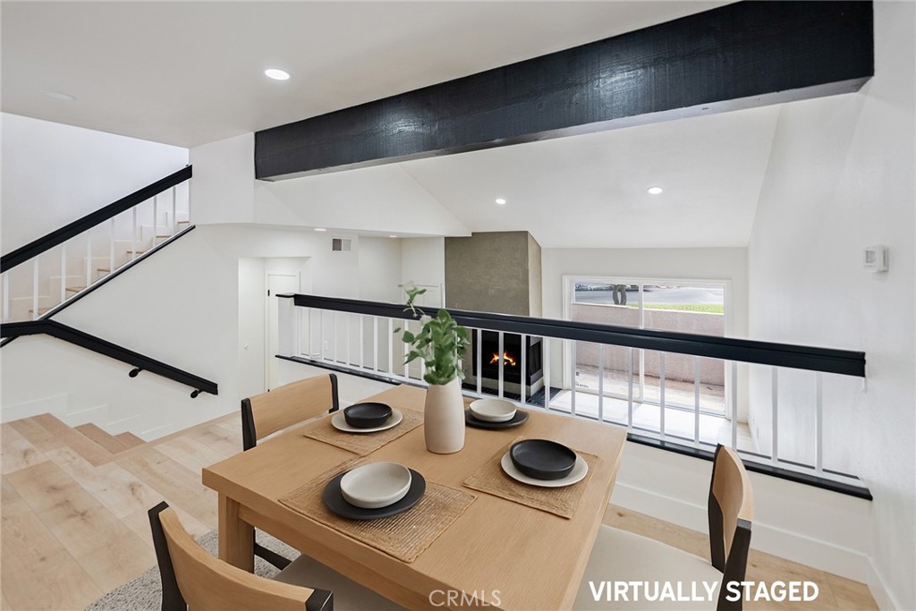 7 Wilderness Place Phillips Ranch, CA 91766 - Photo 14 of 25 a kitchen with dining table and chairs