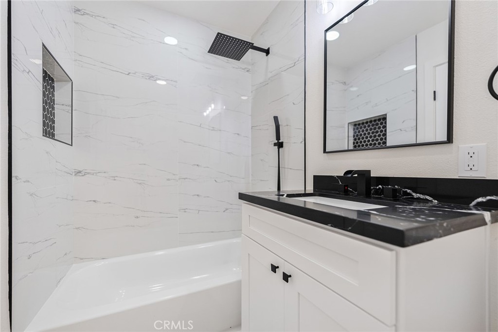 7 Wilderness Place Phillips Ranch, CA 91766 - Photo 17 of 25 a bathroom with a bathtub and a sink