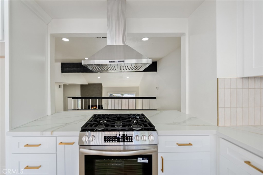 7 Wilderness Place Phillips Ranch, CA 91766 - Photo 5 of 25 a kitchen with a stove and cabinets