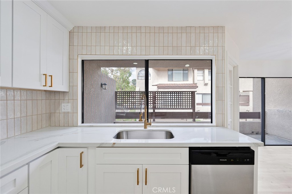 7 Wilderness Place Phillips Ranch, CA 91766 - Photo 6 of 25 a kitchen with a sink and cabinets