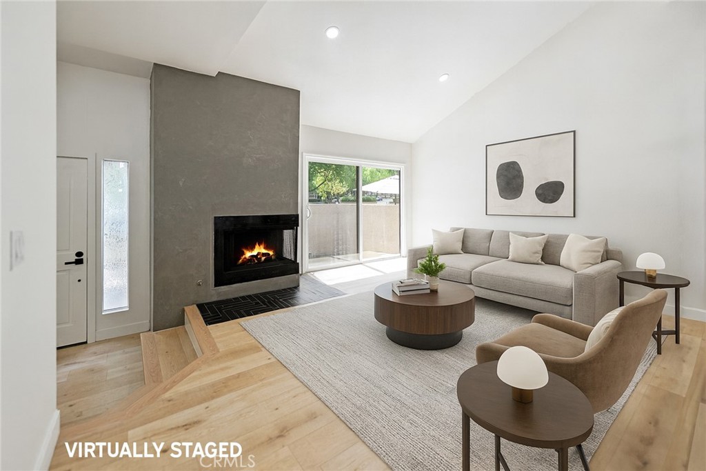 7 Wilderness Place Phillips Ranch, CA 91766 - Photo 9 of 25 a living room with furniture and a fireplace
