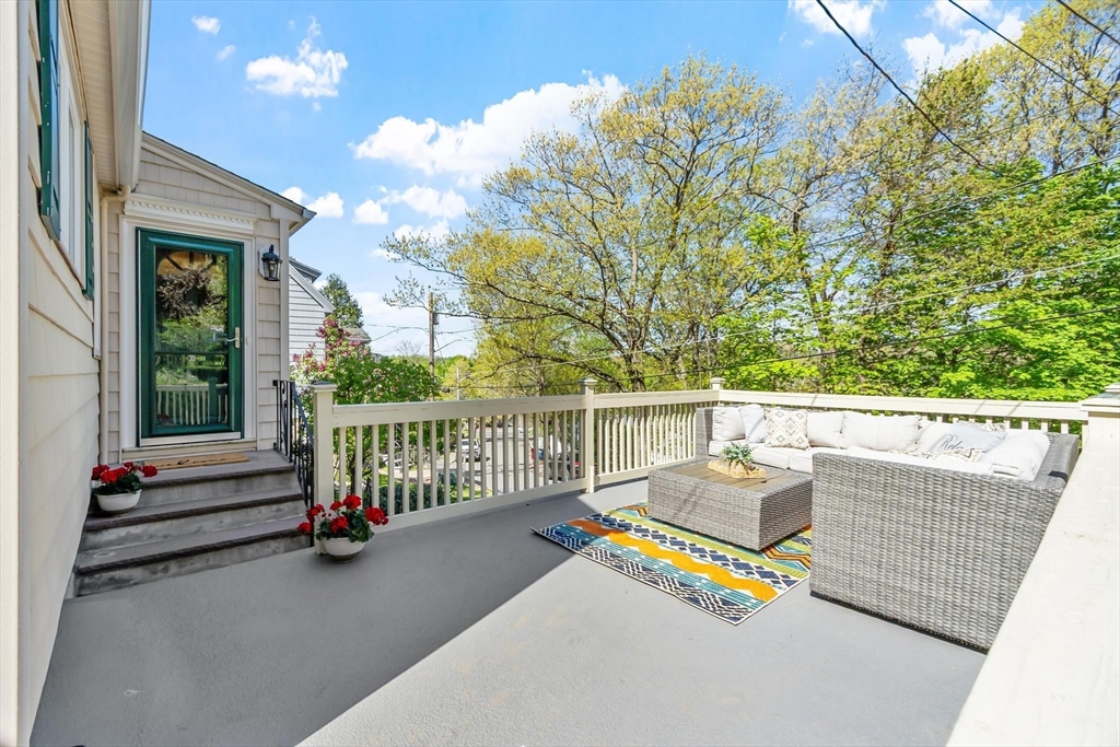 25 Naples Road Melrose, MA 02176 - Photo 25 of 36 a view of deck with furniture and trees