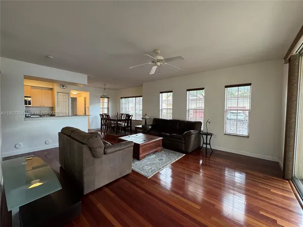 a view of a dining room with furniture and wooden floor