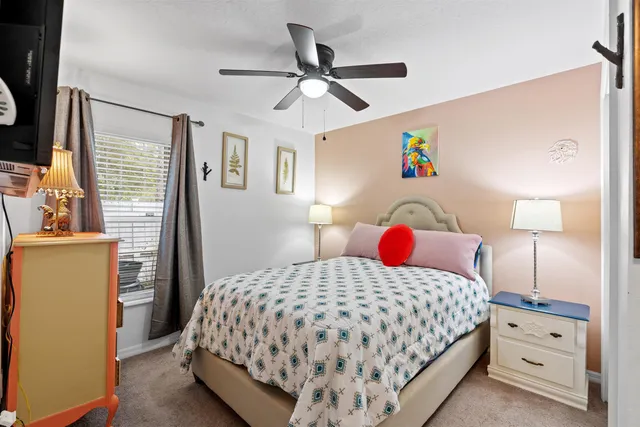 a view of a house with a yard and tree