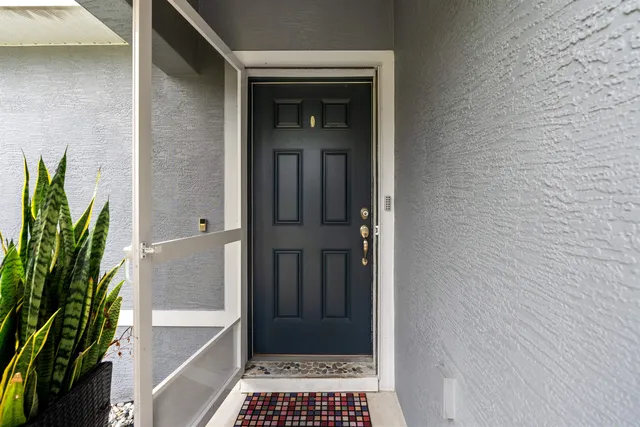 a kitchen with stainless steel appliances granite countertop a stove top oven a sink dishwasher a refrigerator and a refrigerator