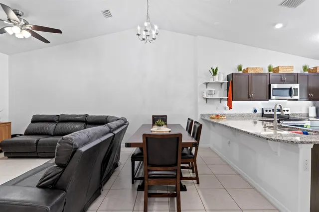 a view of a patio with a table and chairs