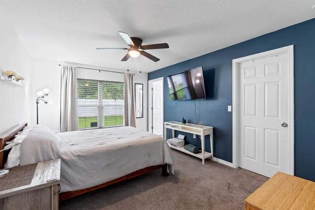 a front view of a house with yard patio and green space