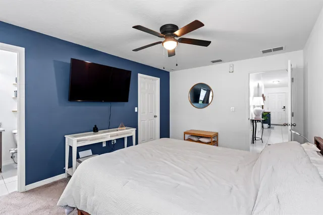 a view of a house with a backyard porch and sitting area