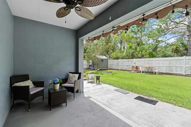 an aerial view of residential houses with outdoor space and street view