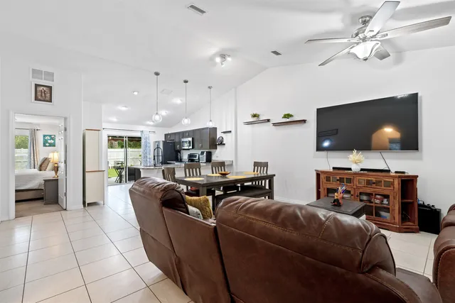 a bathroom with a granite countertop sink toilet a mirror and shower