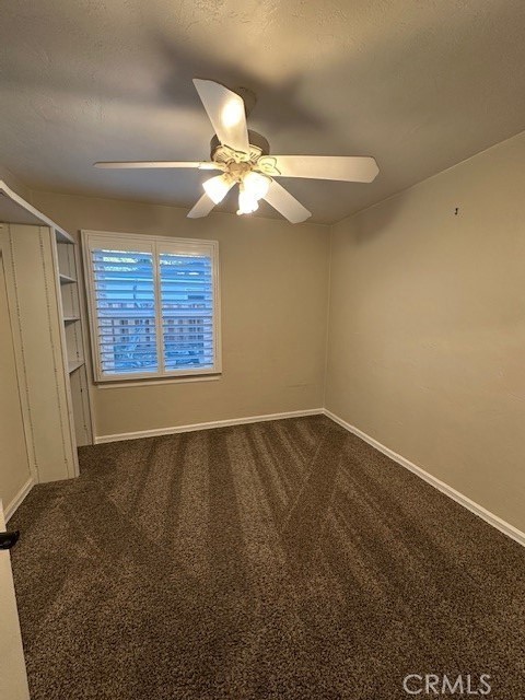 2550 4th Avenue Merced, CA 95340 - Photo 15 of 35 en empty room with windows and ceiling fan
