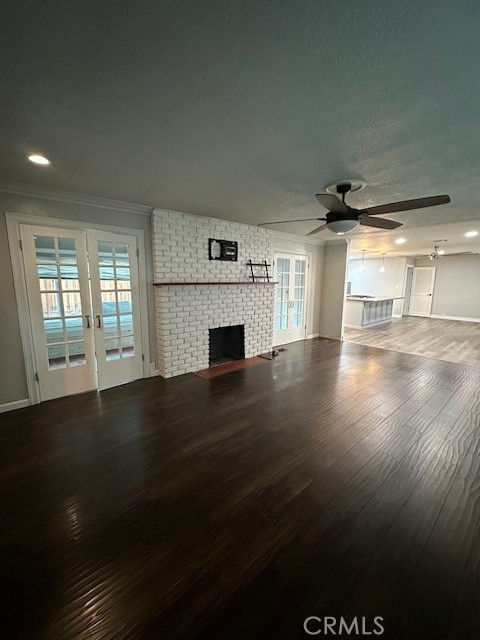 2550 4th Avenue Merced, CA 95340 - Photo 5 of 35 an empty room with wooden floor and windows