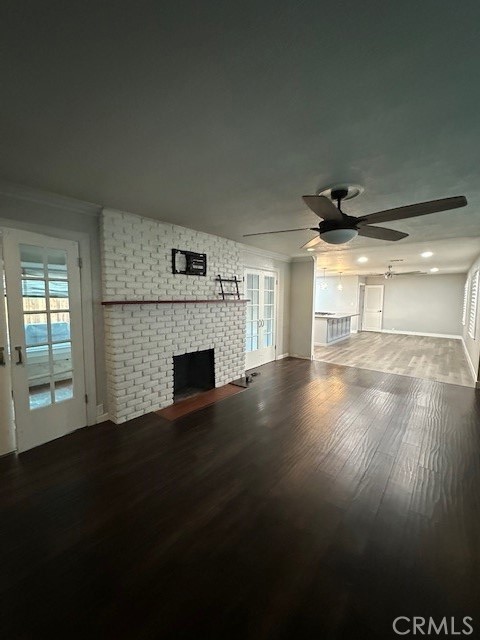 2550 4th Avenue Merced, CA 95340 - Photo 6 of 35 a view of empty room with wooden floor and fireplace