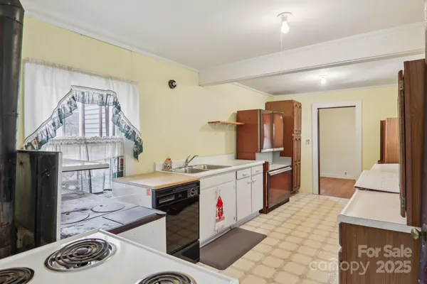 a kitchen with a sink stove and cabinets
