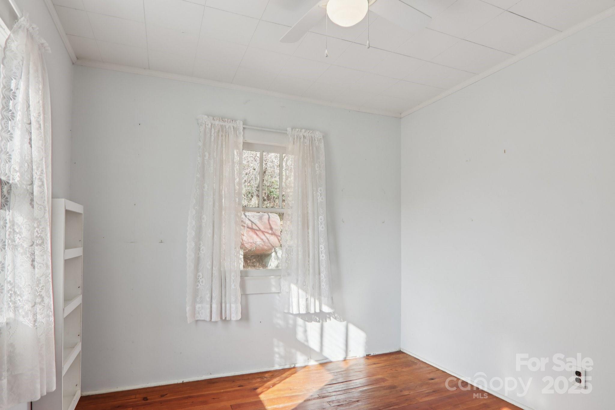 301 Parris Branch Road Sylva, NC 28779 - Photo 15 of 30 a view of bedroom with wooden floor