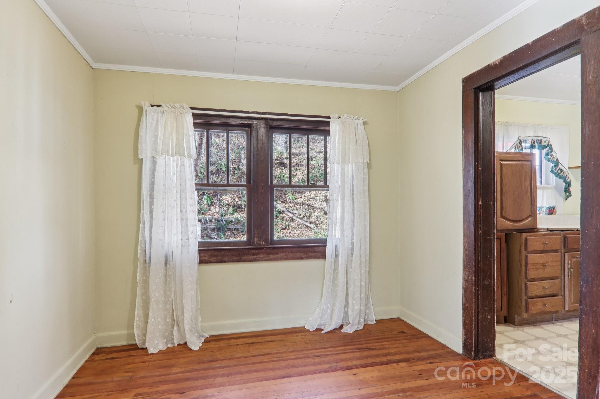 301 Parris Branch Road Sylva, NC 28779 - Photo 16 of 30 a view of bedroom with wooden floor