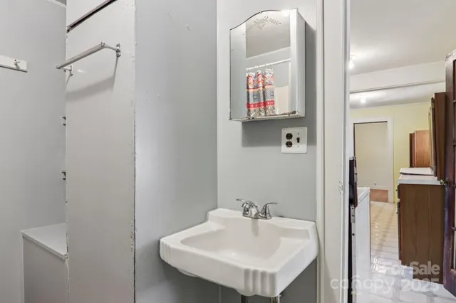 a bathroom with a sink and mirror
