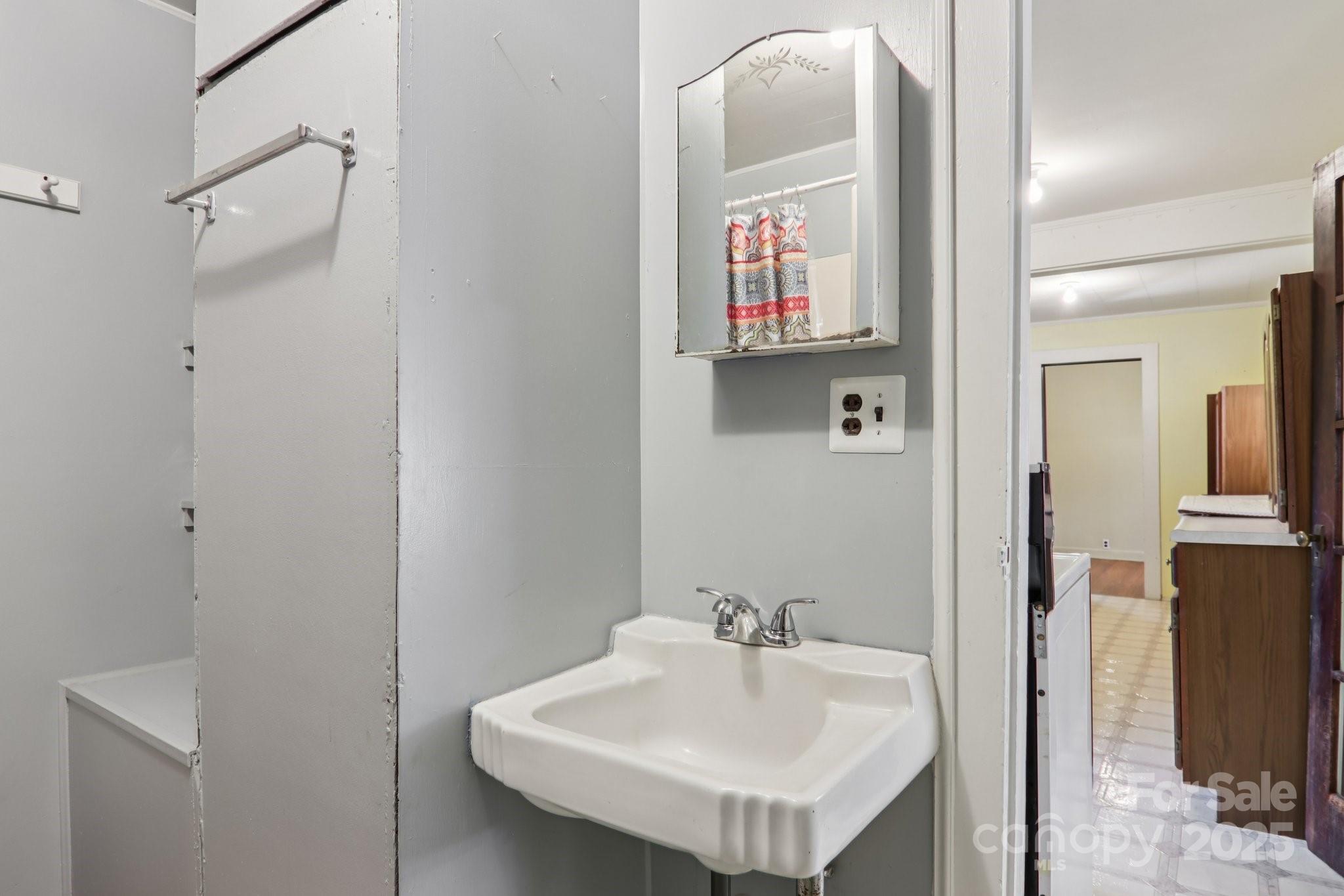 301 Parris Branch Road Sylva, NC 28779 - Photo 18 of 30 a bathroom with a sink and mirror