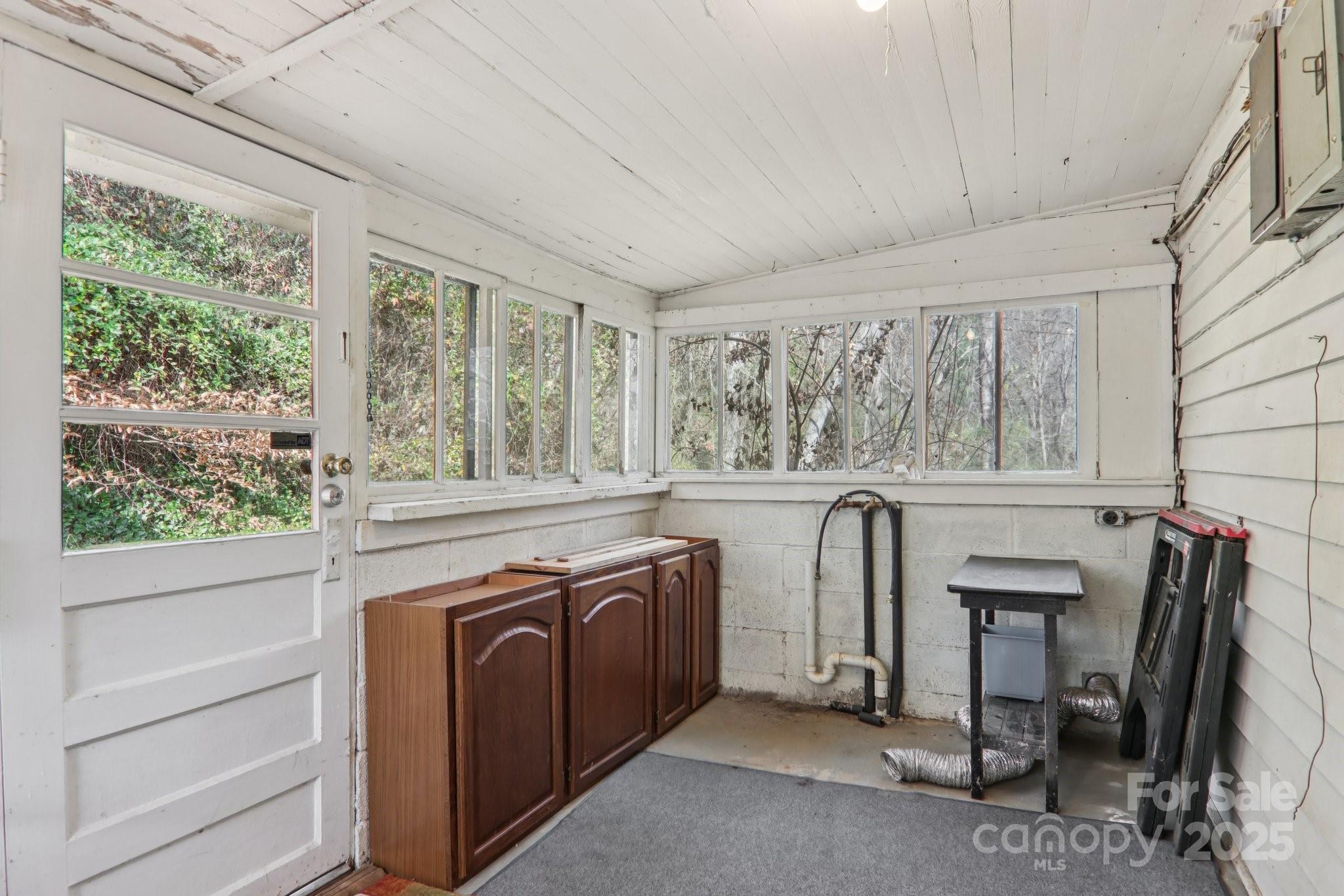 301 Parris Branch Road Sylva, NC 28779 - Photo 20 of 30 a view of a kitchen with furniture and windows