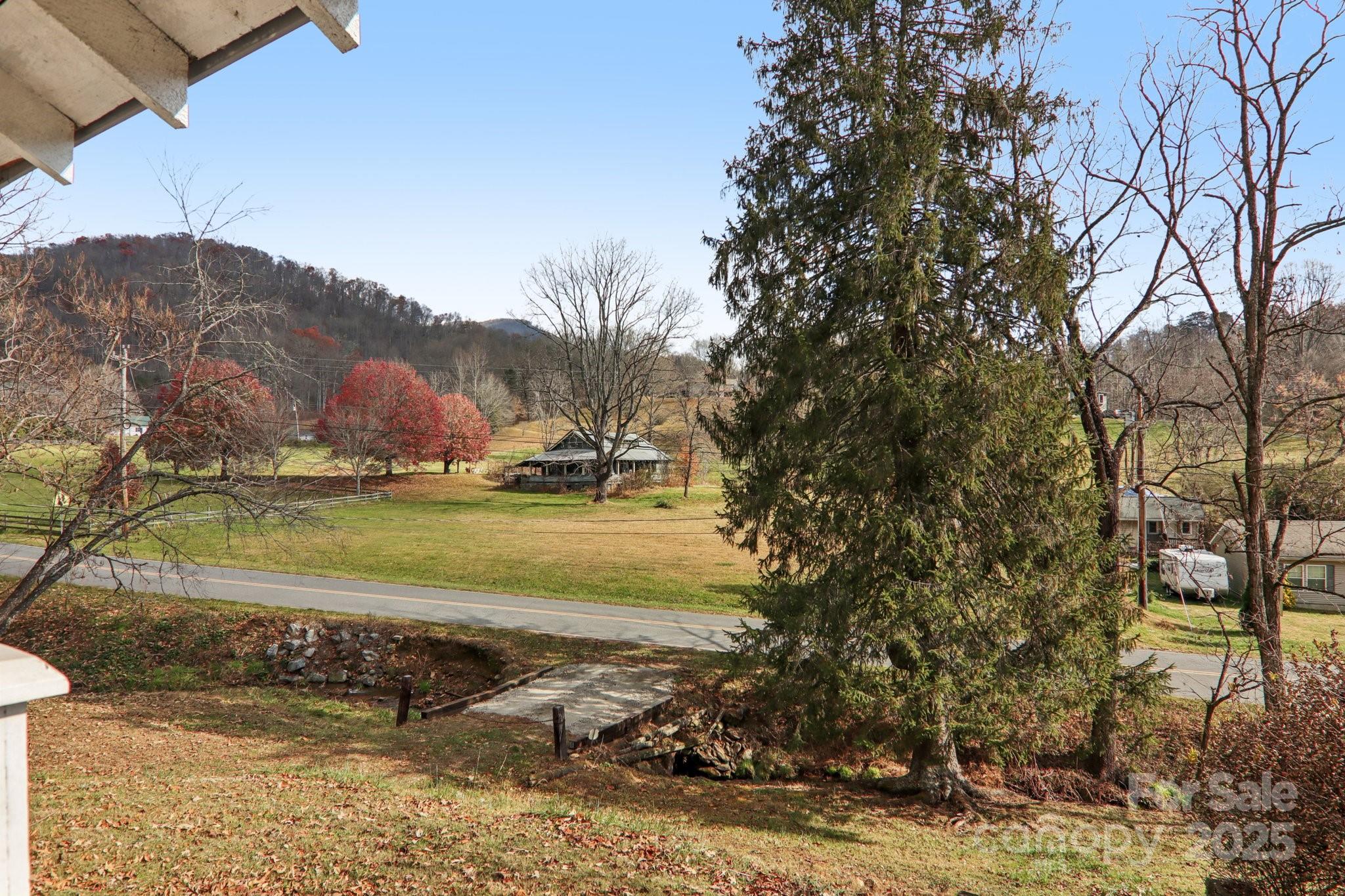 301 Parris Branch Road Sylva, NC 28779 - Photo 22 of 30 a view of a lake with a mountain