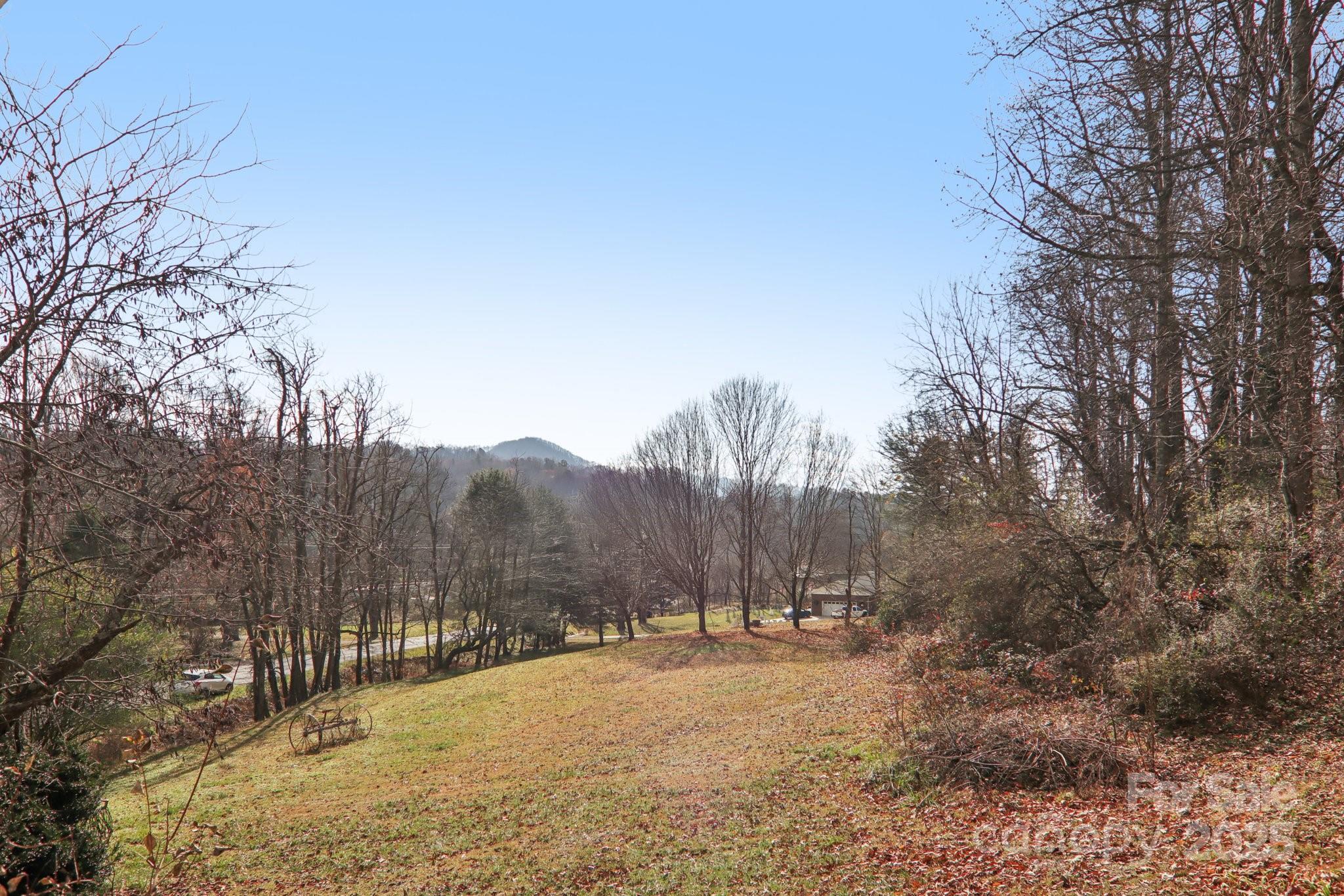 301 Parris Branch Road Sylva, NC 28779 - Photo 24 of 30 a view of a dry yard covered with snow