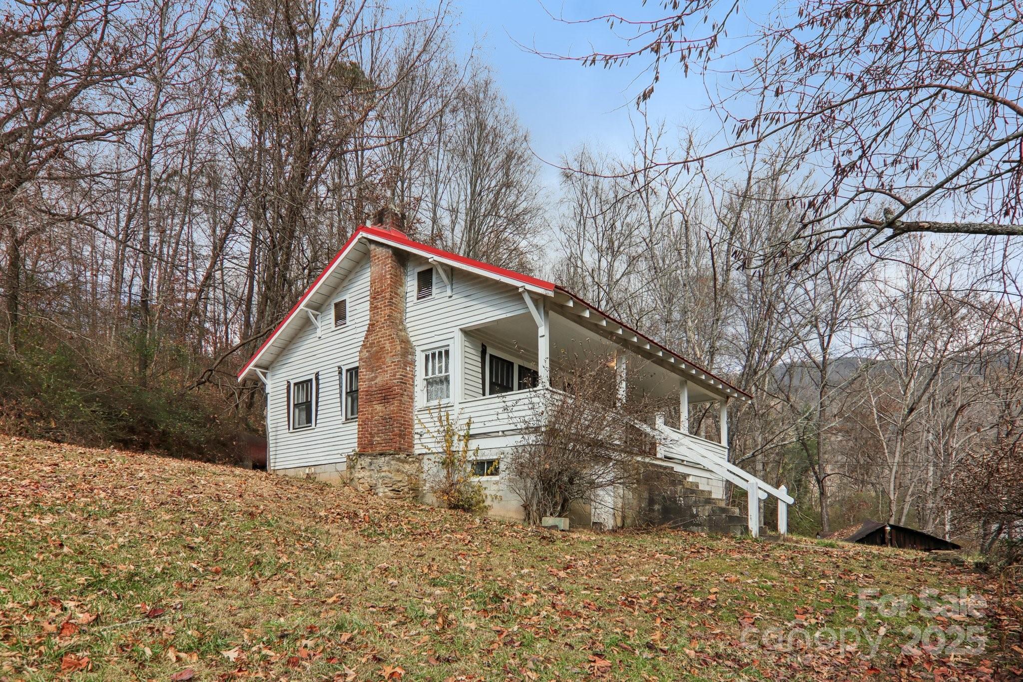 301 Parris Branch Road Sylva, NC 28779 - Photo 26 of 30 a view of a house with a yard