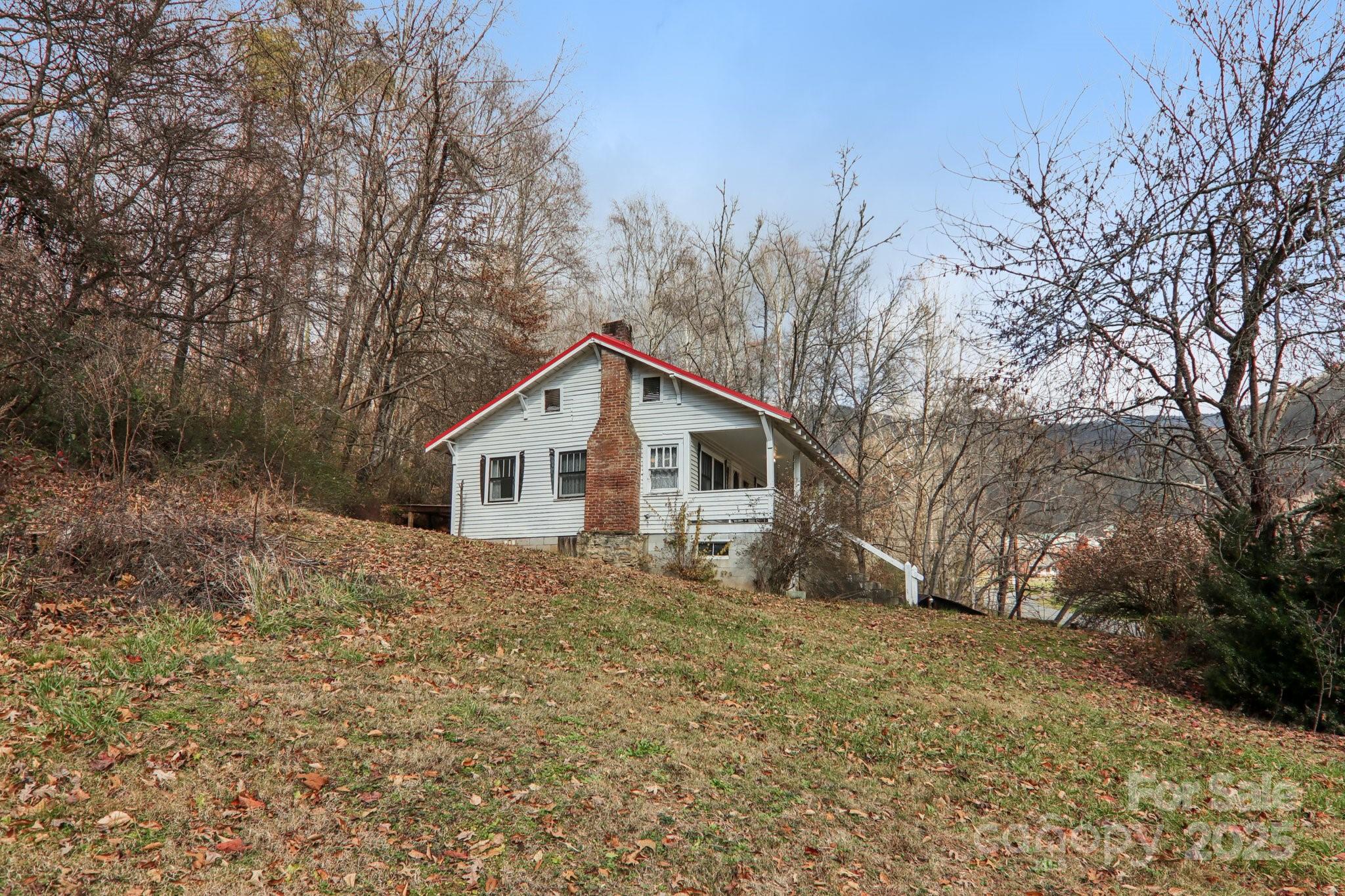 301 Parris Branch Road Sylva, NC 28779 - Photo 27 of 30 a house with trees in the background