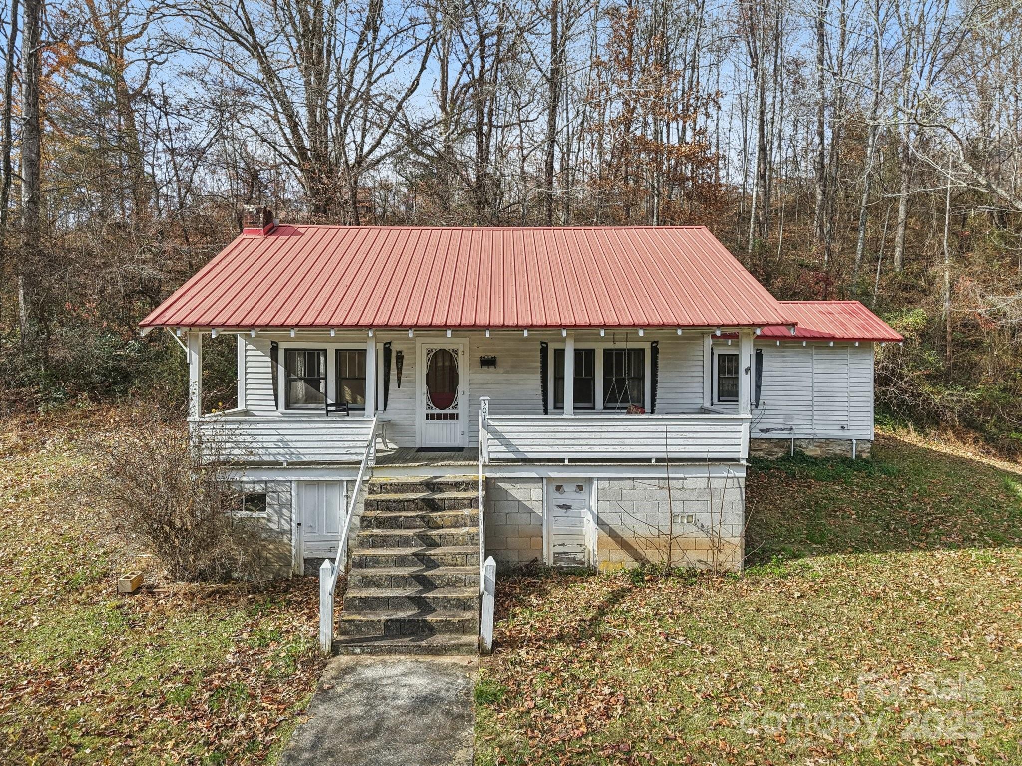 301 Parris Branch Road Sylva, NC 28779 - Photo 3 of 30 a front view of a house with a garden