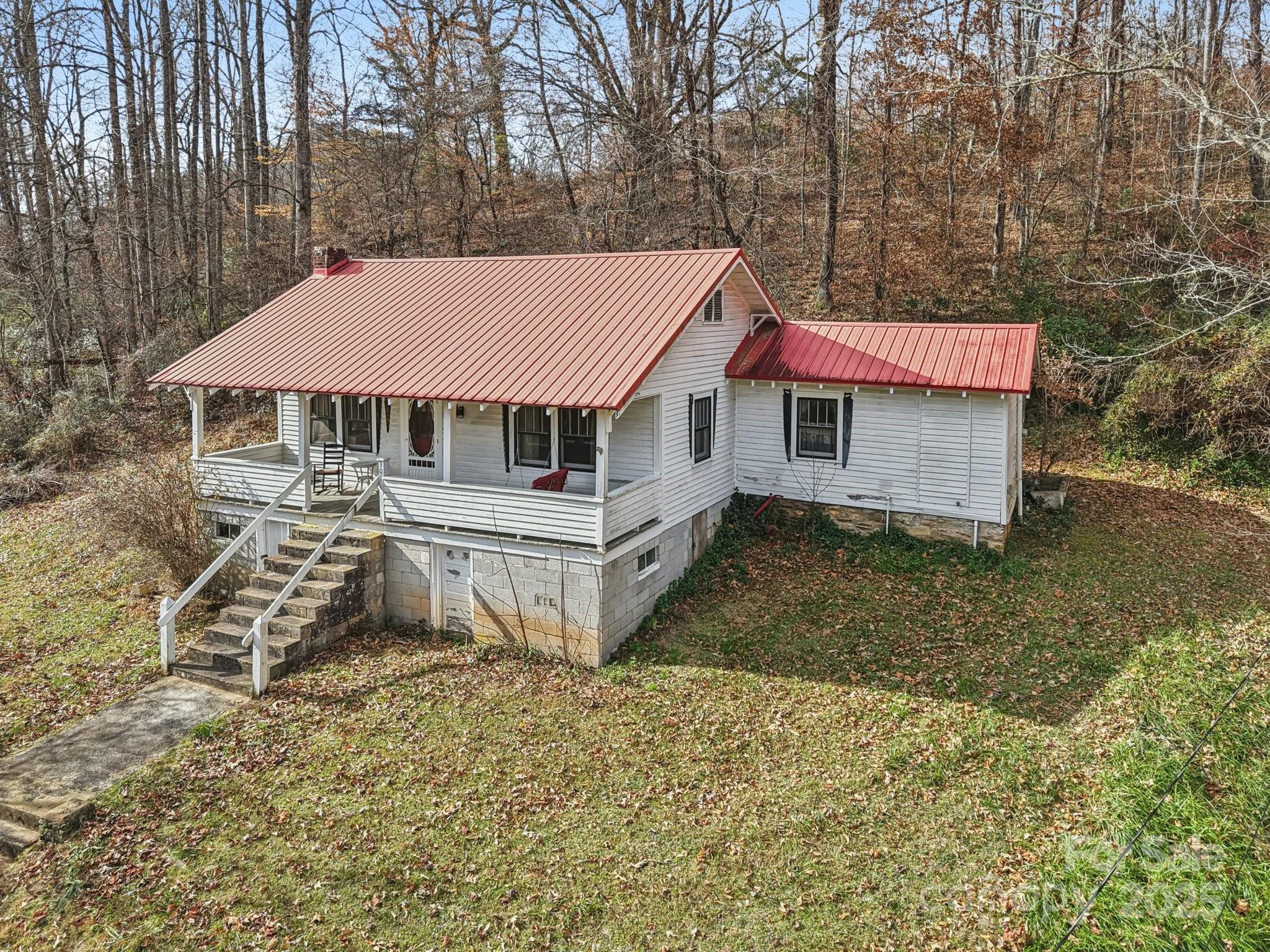 301 Parris Branch Road Sylva, NC 28779 - Photo 4 of 30 a aerial view of a house with a yard