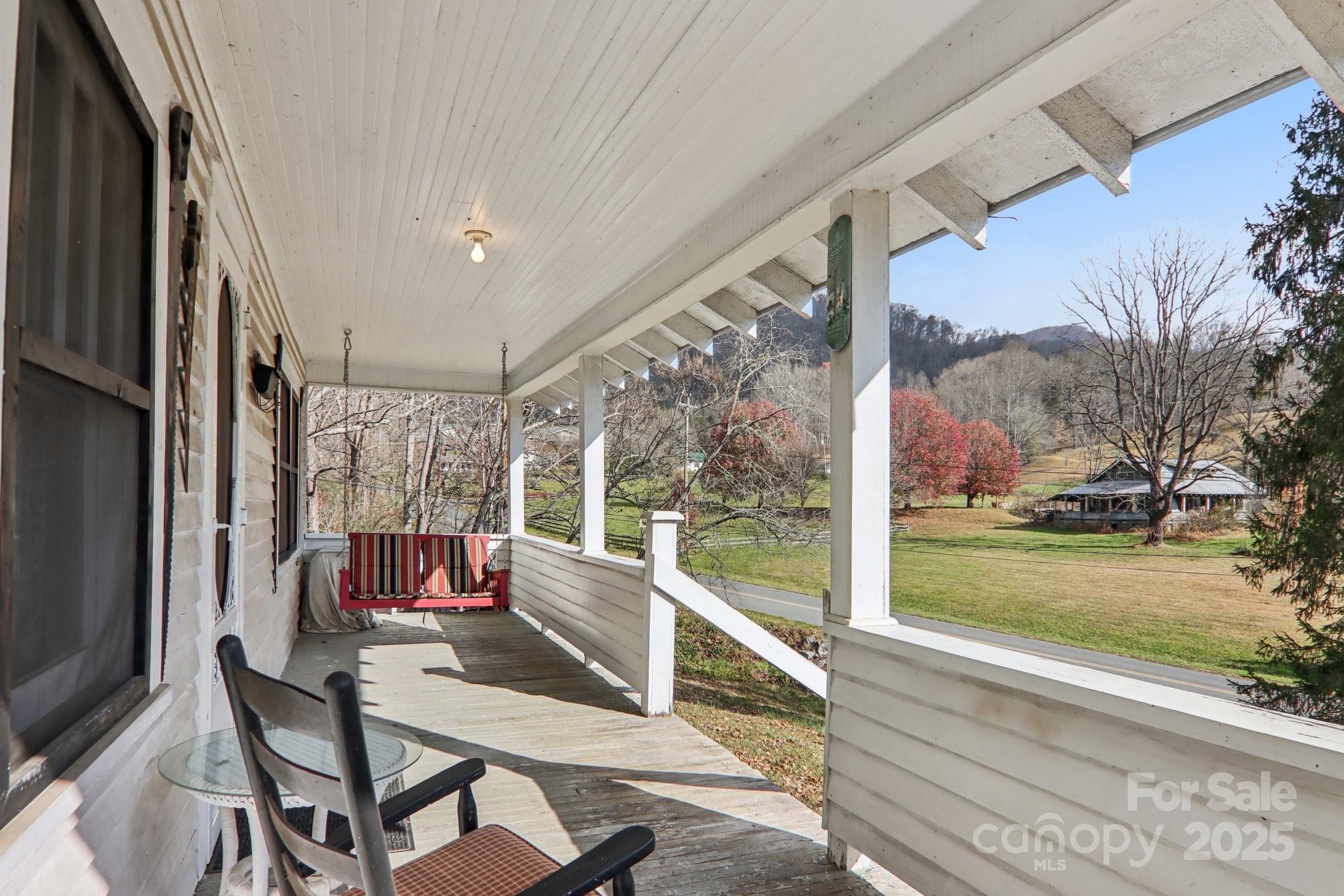 301 Parris Branch Road Sylva, NC 28779 - Photo 8 of 30 a living room with large windows and a table
