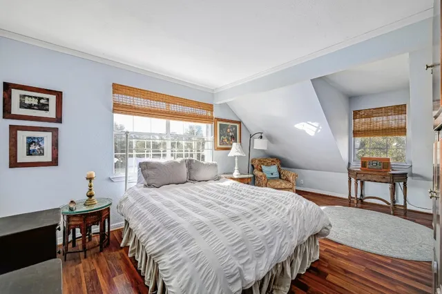 a bedroom with a bed and a table