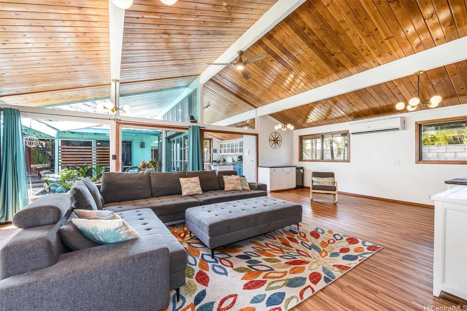 313 Kuliouou Road Honolulu, HI 96821 - Photo 1 of 1 a living room with furniture and wooden floor