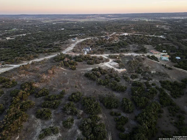 an aerial view of residential house and green space