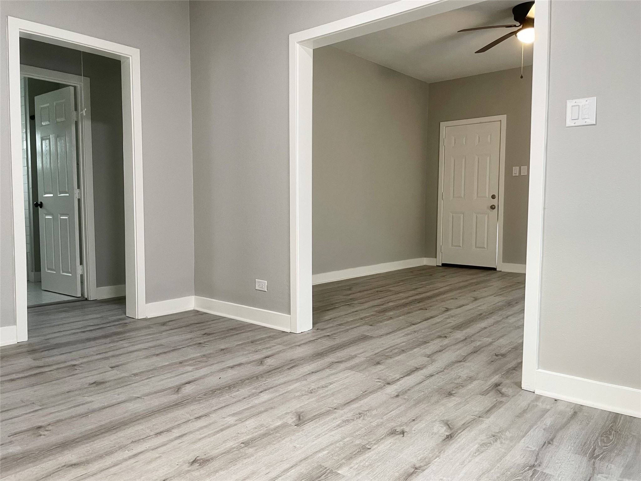 2609 3rd Street Rosenberg, TX 77471 - Photo 5 of 12 Newly added luxury vinyl plank and bronze ceiling fans. LARGE living + dining space