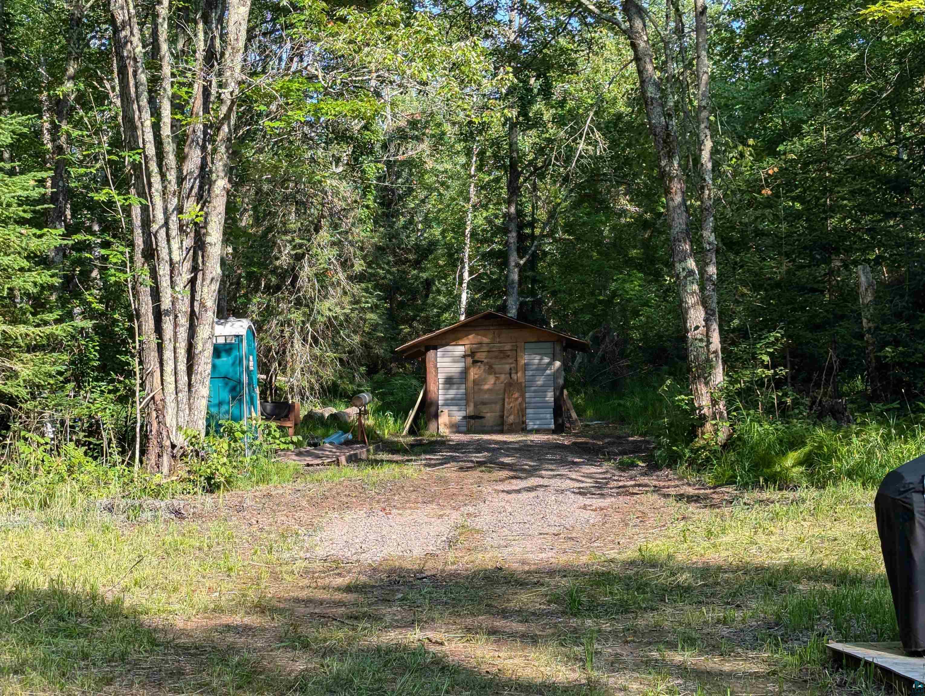 2279 East Summit Trail Summit, WI 54836 - Photo 4 of 7 View of yard with a storage unit