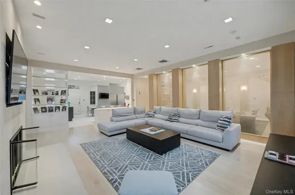 a large kitchen with a large counter top appliances and cabinets